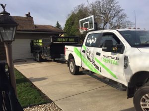 U-Fill We-Haul pickup truck and waste dumpster serviced in the Northern Illinois region for responsible waste disposal.